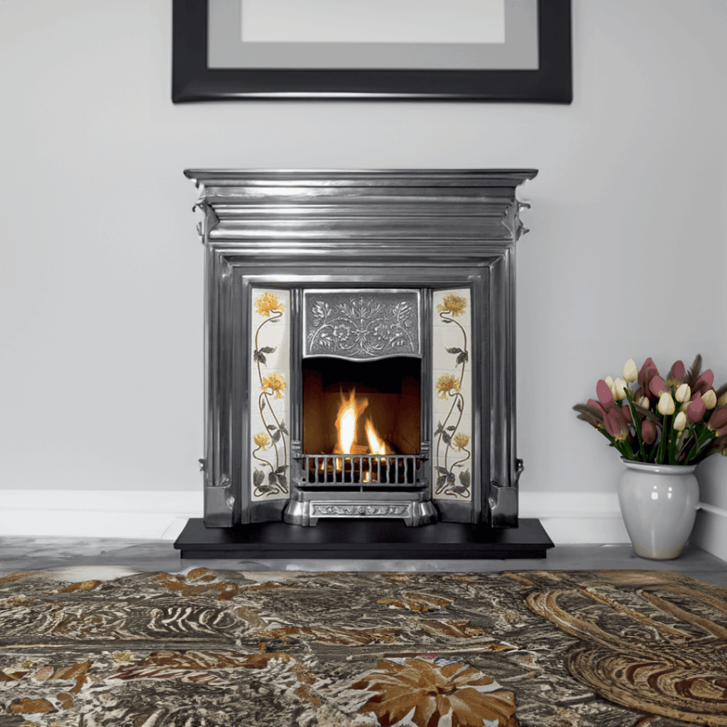 A beautifully restored Victorian fireplace featuring ornate cast iron and a classic white marble surround, set in an elegant period living room.